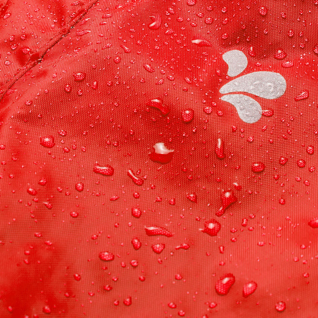 Close-up of the red Originals Waterproof Trousers with water droplets, showcasing the waterproof material and small white logo.